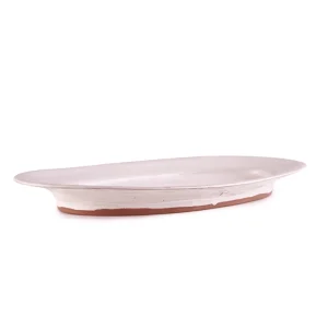 Perfect Hideaways: Angled side view of a handmade Classic Fish Platter showcasing its gentle curve and earthy base. Perfect Hideaways shop