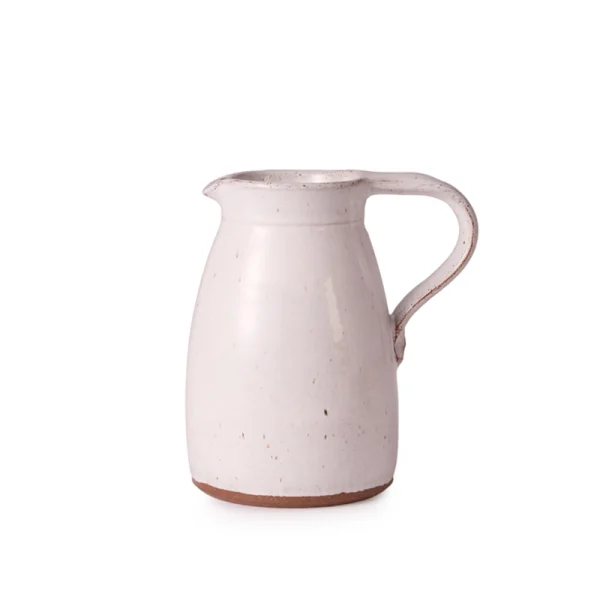 Perfect Hideaways: A handcrafted Water Jug with a gently rounded form, pale speckled glaze, and wide pouring lip, perfect for serving or display. The shop