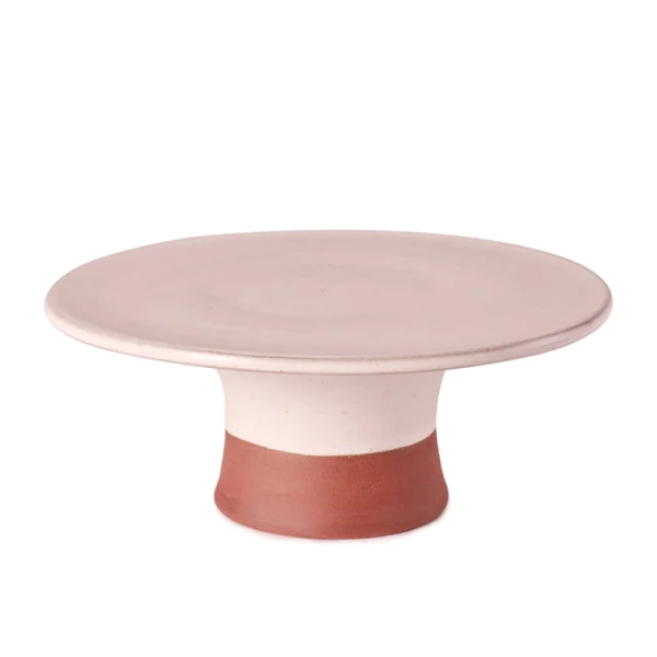 Perfect Hideaways: A minimalist pink-toned country cake stand with a broad flat top and warm terracotta base, ideal for stylish dessert presentations. Perfect Hideaways shop