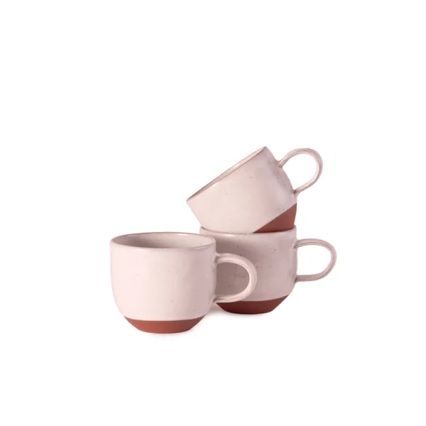 Perfect Hideaways: A set of three Country Round Mugs stacked in a playful arrangement, highlighting their speckled white glaze and unglazed terracotta bases. Perfect Hideaway shop