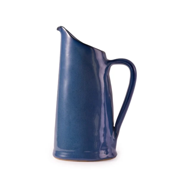 Perfect Hideaways: A single XL ceramic water jug in deep navy blue by Mervyn Gers, with a glossy finish and elongated spout. The shop