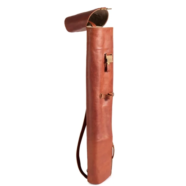 Perfect Hideaways: The Jack Sack. Side profile of a vintage-inspired leather yoga mat bag showing its curved flap opening, shoulder strap, and structured form. Perfect Hideaways shop
