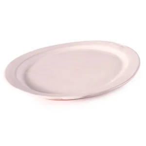 Perfect Hideaways: Overhead view of a minimalist country oval ceramic platter with subtle organic contours and matte finish. Perfect Hideaways shop