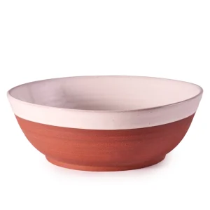 Perfect Hideaways: Side view of a terracotta and cream-toned country serving bowl, showcasing its smooth, hand-thrown form and artisanal finish. Perfect Hideaways shop