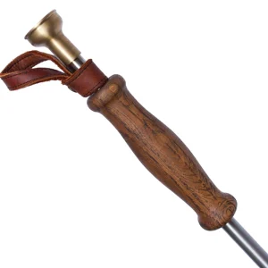 Perfect Hideaways: Donkey Fire Blower. Close-up of a smooth, contoured wooden handle with visible grain and a leather strap, showcasing the fine craftsmanship of this elegant fire blower. Perfect Hideaways shop
