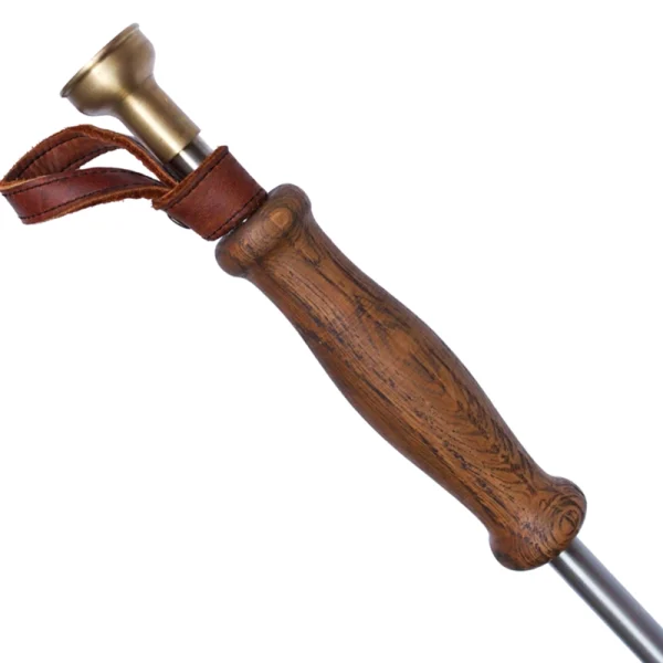 Perfect Hideaways: Donkey Fire Blower. Close-up of a smooth, contoured wooden handle with visible grain and a leather strap, showcasing the fine craftsmanship of this elegant fire blower. Perfect Hideaways shop