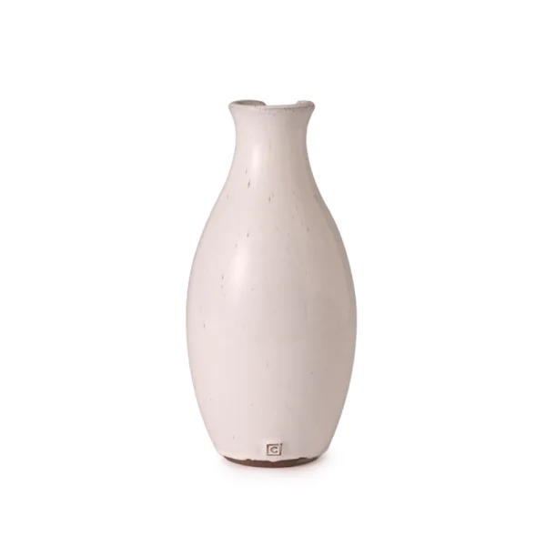 Perfect Hideaways: Rear view of the off-white ceramic Classic Round Jug, showing its curved form and maker’s mark stamped near the base. The shop