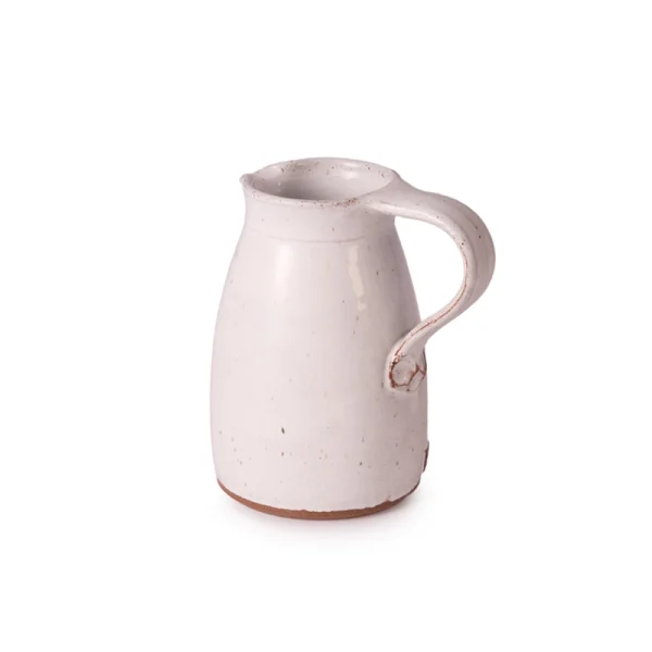 Perfect Hideaways: Side angle of a rustic white Water Jug highlighting the curve of its sturdy handle and minimal artisanal finish. The shop
