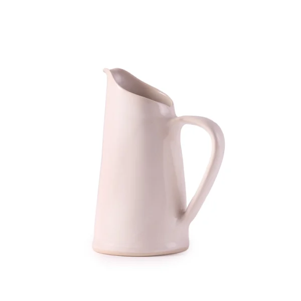 Perfect Hideaways: A single L ceramic water jug in creamy matte white by Mervyn Gers, featuring a smooth, minimalist form and a gently angled lip. The shop