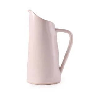 Perfect Hideaways: A side angle of the white ceramic water jug by Mervyn Gers, revealing the softly sculpted contours and matte finish. The shop