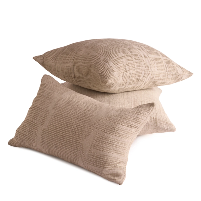 Perfect Hideaways: A stack of three Bogolan Classic Cushion Cover in earthy beige tones with a textured, grid-like pattern, adding a soft and tactile element to any lounge or bedroom. Perfect Hideaways shop