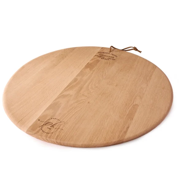 Perfect Hideaways: A round oak cheese platter with a natural finish, engraved with a Perfect Hideaways logo and fitted with a leather hanging loop. Perfect Hideaways shop