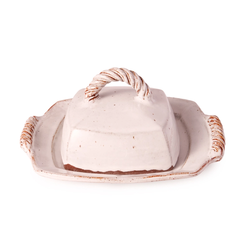 Perfect Hideaways: A handcrafted ceramic butter dish with a twisted rope-style handle and rustic glaze detailing, blending artisanal charm with functionality – Perfect Hideaways shop