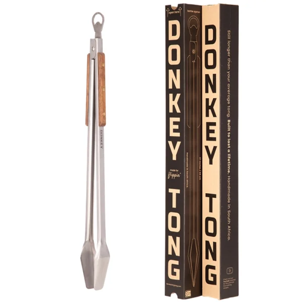 Perfect Hideaways: Donkey Tong braai tongs displayed beside their branded cardboard packaging, highlighting the tool’s robust design. Perfect Hideaways shop