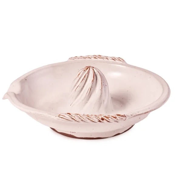 Perfect Hideaways: Handcrafted ceramic citrus squeezer with ribbed detail and an earthy, glazed white surface, photographed on a white background. Perfect Hideaways shop
