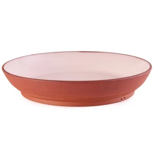 Perfect Hideaways: A handcrafted terracotta and blush ceramic Wide Country Lebrillo platter with a low-profile rim and footed base, offering a minimalist rustic aesthetic, Perfect Hideaways shop