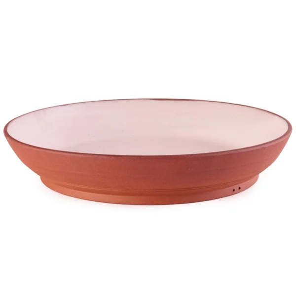 Perfect Hideaways: A handcrafted terracotta and blush ceramic Wide Country Lebrillo platter with a low-profile rim and footed base, offering a minimalist rustic aesthetic, Perfect Hideaways shop