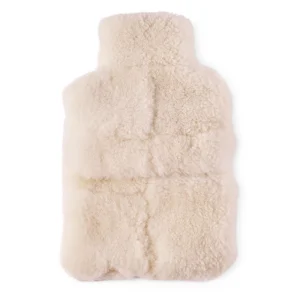 Perfect Hideaways: A plush ivory-coloured sheepskin hot water bottle cover with a soft, quilted texture designed for warmth and comfort. Perfect Hideaways shop