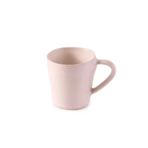 Perfect Hideaways: A single ceramic flare mug in a soft matte cream finish with an elegantly shaped handle and flared lip. The shop