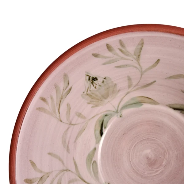 Perfect Hideaways: Close-up of a hand-painted terracotta bowl interior, showcasing a soft protea design with leafy branches in green tones on a pale glazed background. Perfect Hideaways shop.