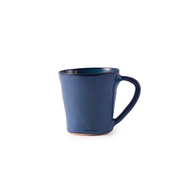 Perfect Hideaways: A single ceramic flare mug in a rich indigo blue glaze with a slightly flared rim and curved handle, perfect for serving tea or coffee. The shop