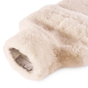 erfect Hideaways: Close-up view of the opening of a sheepskin hot water bottle cover, revealing its soft fleece lining and subtle stitched detail. Perfect Hideaways shop