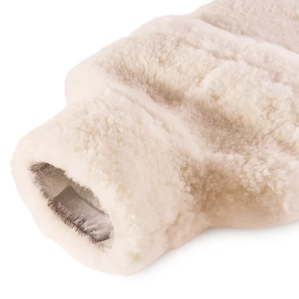 erfect Hideaways: Close-up view of the opening of a sheepskin hot water bottle cover, revealing its soft fleece lining and subtle stitched detail. Perfect Hideaways shop