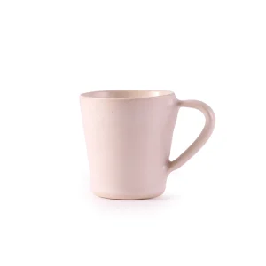 Perfect Hideaways: A minimalist cream ceramic flare mug shown from a slightly different angle, highlighting its sculptural form and handle. The shop