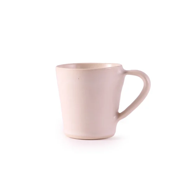 Perfect Hideaways: A minimalist cream ceramic flare mug shown from a slightly different angle, highlighting its sculptural form and handle. The shop