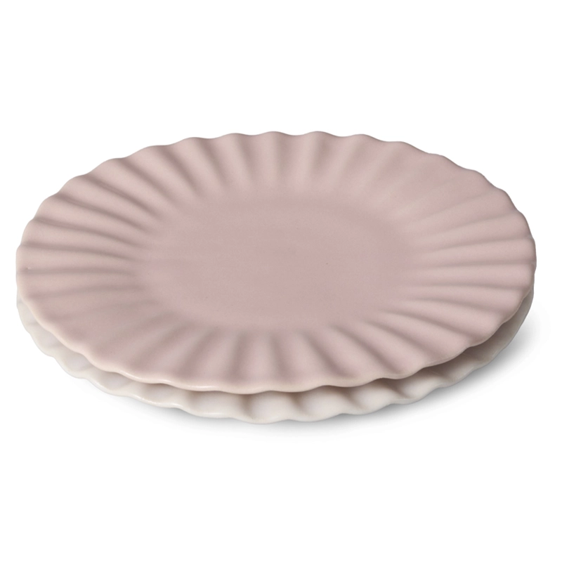 Perfect Hideaways delicate ceramic plate set in a soft blush pink shade, designed with scalloped edges and a matte finish, styled to evoke a paper plate look — Perfect hideaways shop.