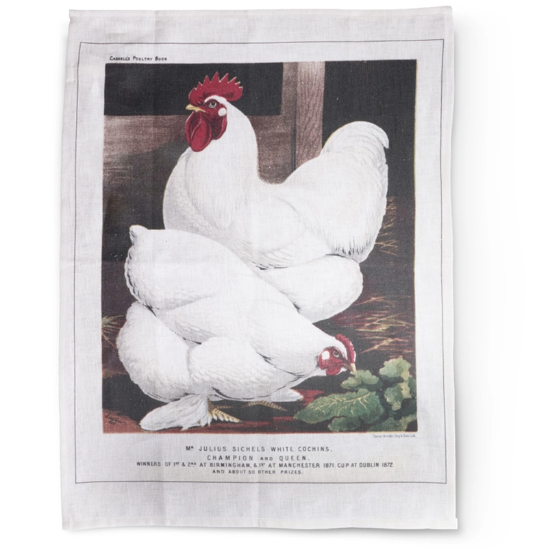 Perfect Hideaways elegant linen tea towel featuring a vintage illustration of two white chickens, one standing proudly and the other pecking near green leaves, with a rustic barn background and printed text below. Perfect hideaways shop.