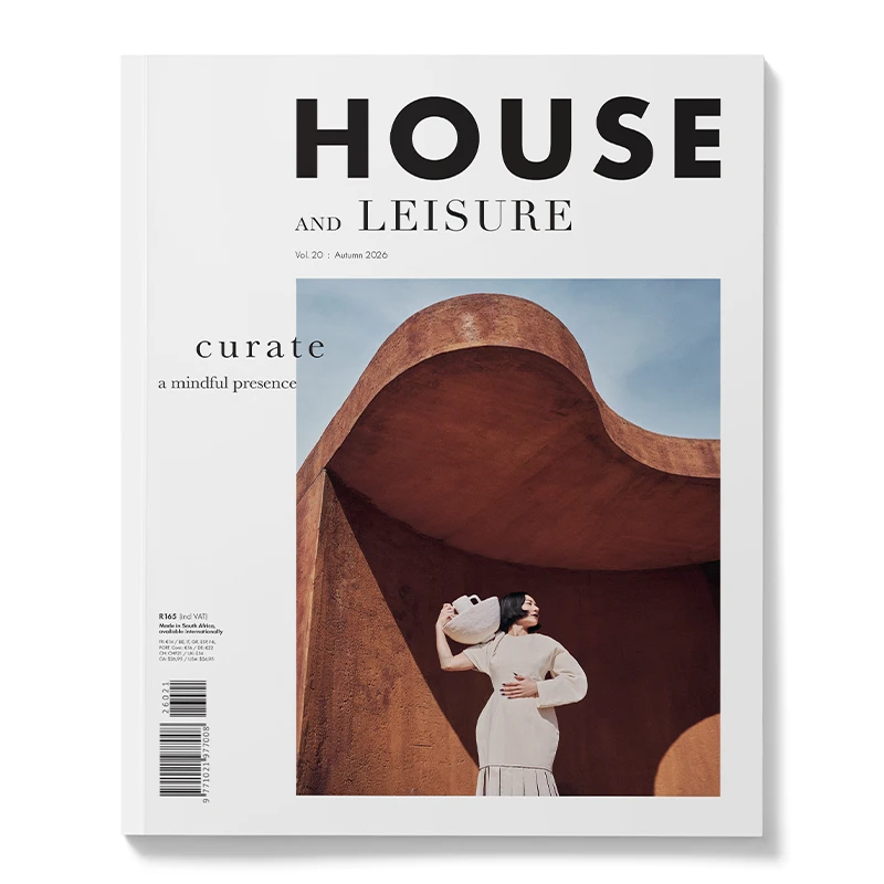 Perfect Hideaways House and Leisure magazine cover featuring a woman in a neutral outfit posing beneath a sculptural terracotta architectural arch against a blue sky Perfecthideawaysshop