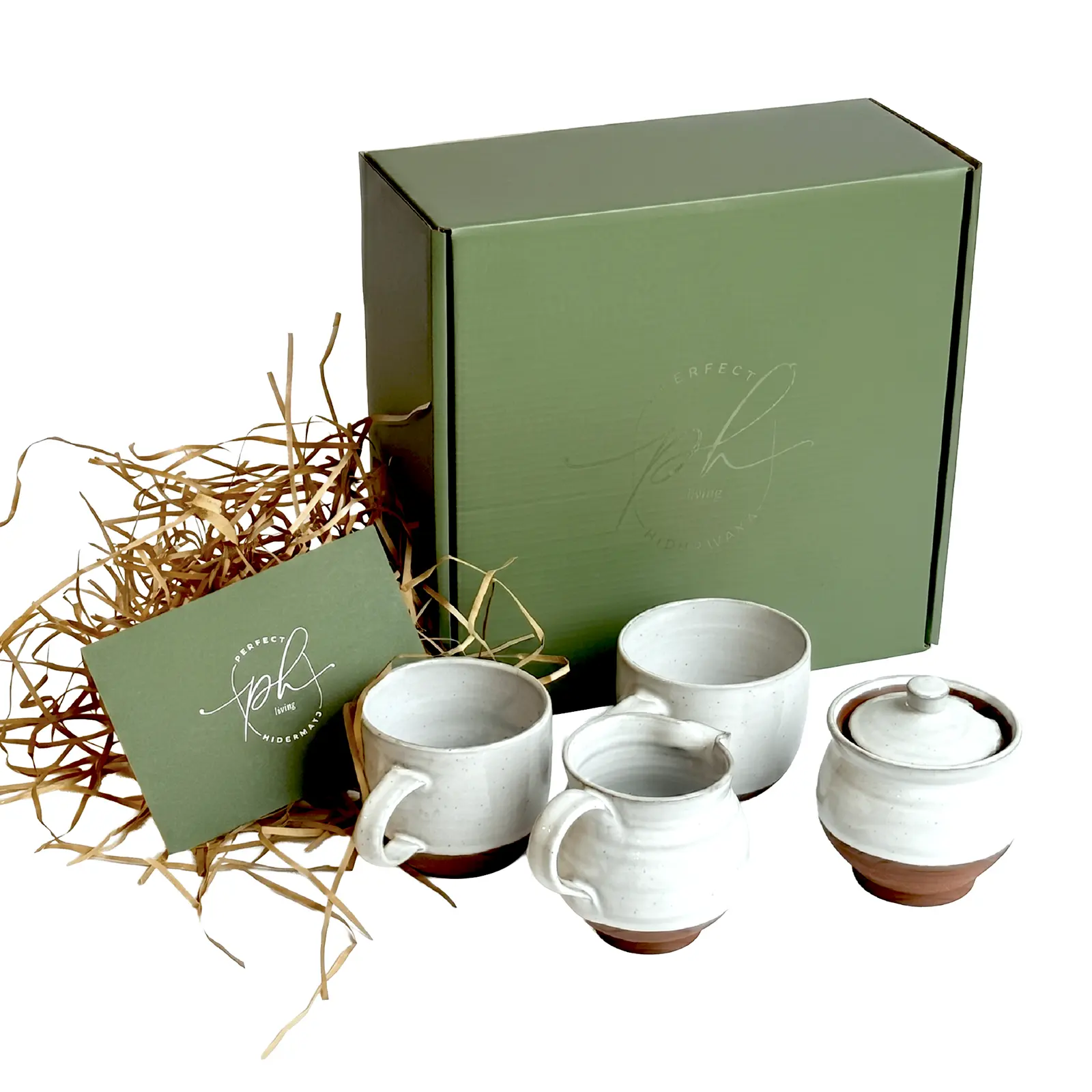 Gifting Perfect Hideaways ceramic tea set gift box with handmade mugs, milk jug and sugar bowl in earthy white and terracotta tones, beautifully packaged in a green presentation box with branded card and natural straw filling Perfecthideawaysshop